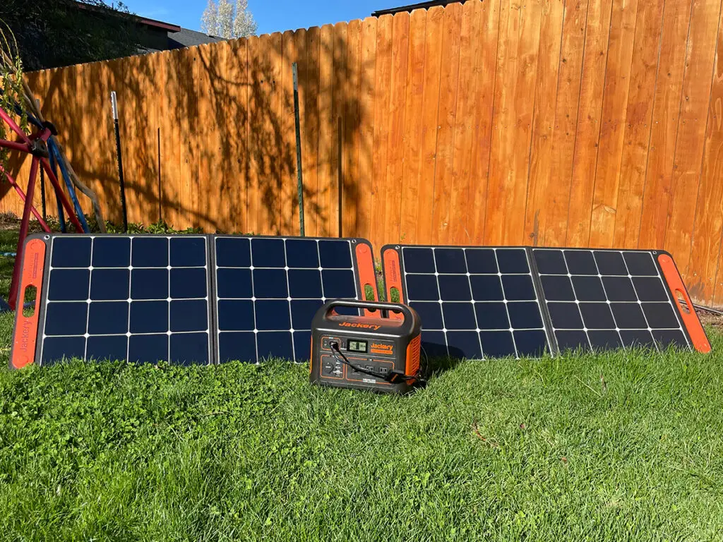 Photo of my Jackery solar generator sitting in the grass
